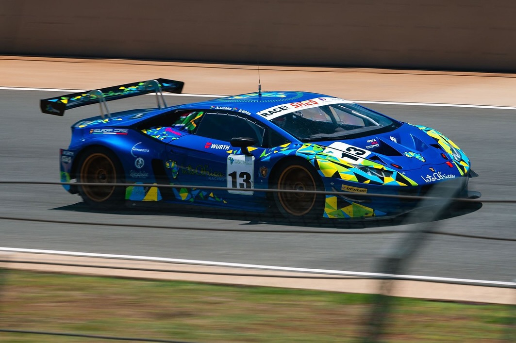 Into Africa Lamborgini speeding past on the track